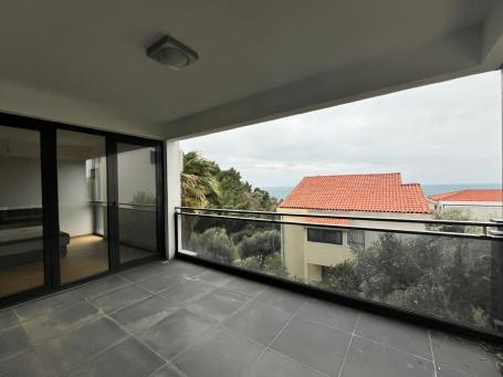 A large apartment in a new building on Sveti Stefan is offered for sale. 