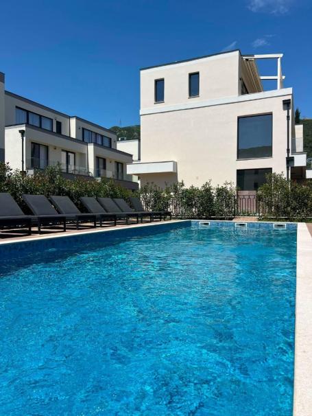 Townhouse in Budva in a gated community with a swimming pool and private grounds