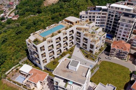 Jednosoban stan 54m2 sa pogledom na more u novom stambenom kompleksu sa bazenom, Becici