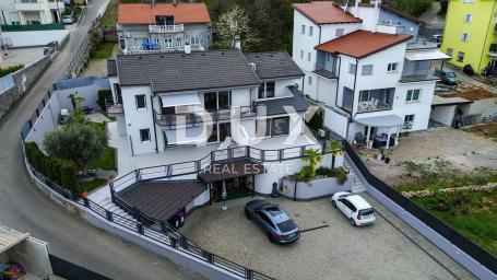 OPATIJA, OPRIĆ - Moderna nekretnina u oazi mira s pet stambenih jedinica i okućnicom blizu mora